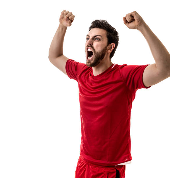 istock Fan / Sport Player on red uniform celebrating on white background 694622718