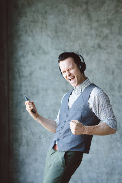 istock Studio portrait of funky, excited caucasic young man 694624918