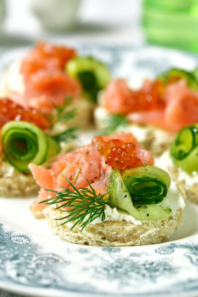 istock Canape with salmon,cucumber and red caviar 694624952