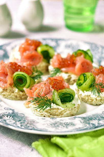 istock Canape with salmon,cucumber and red caviar 694624956