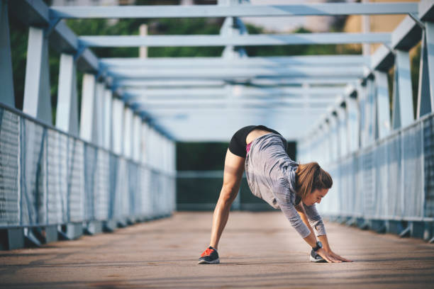 istock Young woman exercising 694641046
