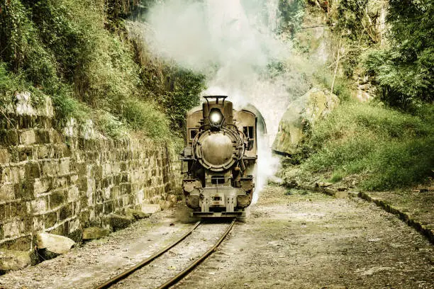 Steam narrow-gauge train moves from Yuejin to Bagou through the tunnel. Jiayang Mining Region. Sichuan province. China.