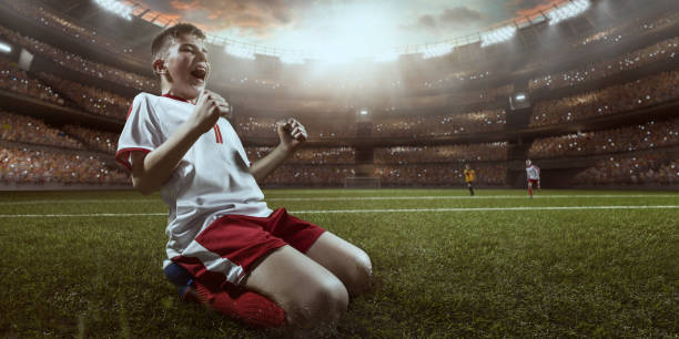 istock Soccer kids player rejoice at victory 694657736