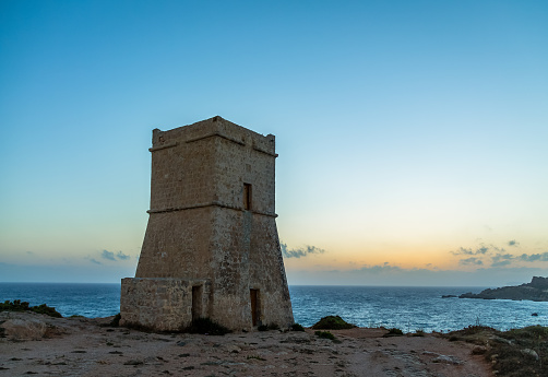 Ghajn Tuffieha Tower in Golden Bay at sunset - Malta