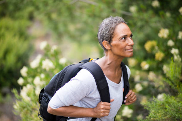 istock African American Senior Woman Exploring Backpacking 694670618