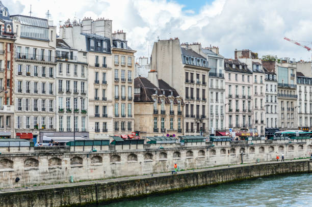 istock Paris street scene and architecture along the Seine River 694676630
