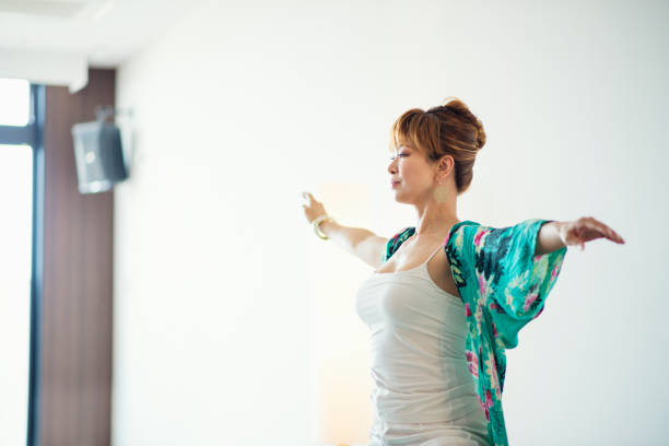 istock Yoga instructor teaching yoga in yoga class 694679454