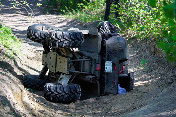 A quad on its side after it has been accidentally flipped A quad on its side after it has been accidentally flipped. quadbike photos stock pictures, royalty-free photos & images