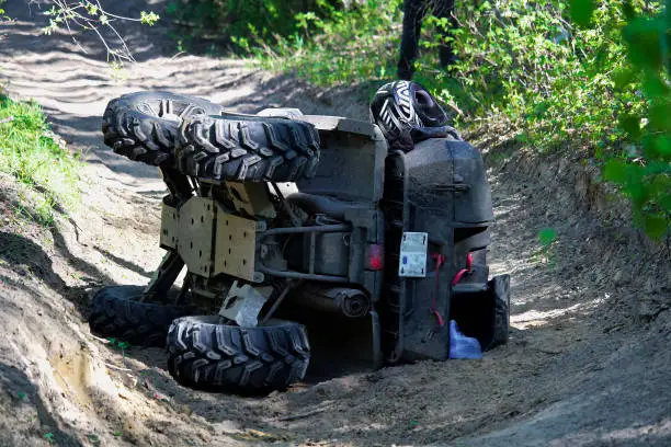 Photo of A quad on its side after it has been accidentally flipped