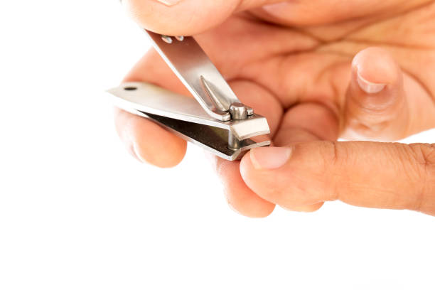 istock hand manicure with nail clipper 694691878