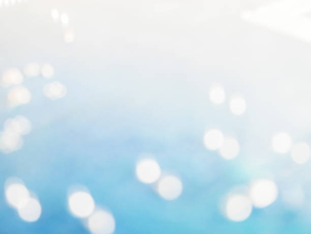 istock abstract blue bokeh light background with copy space on white area 694704116