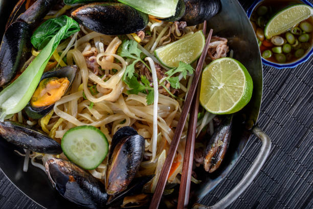 istock Delicious Asian Noodle with Bean Sprout , Mussel and Vegetables 694706488
