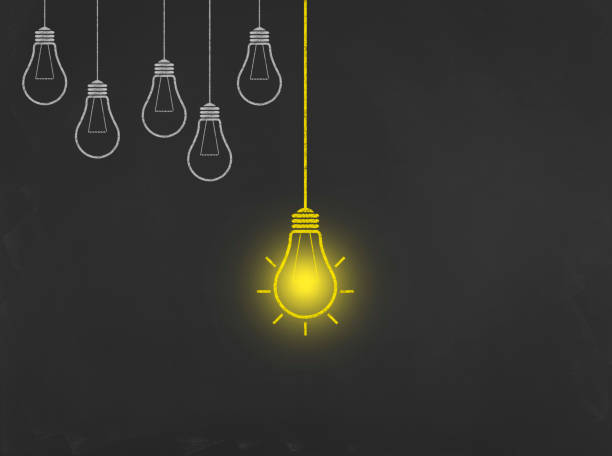 istock Light Bulb Concept - Business Chalkboard Background 694706566