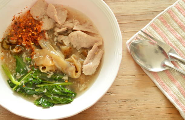 istock stir fried large noodle with marinated pork in gravy sauce 694712952