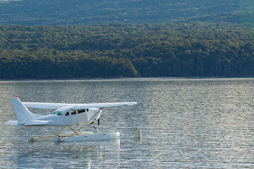 water propeller plane floating on fresh water lake