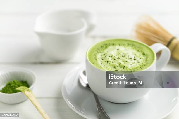 Matcha Latte Cup Close Up Background Blurred Stock Photo - Download Image Now - Matcha Tea, Latte, Ground - Culinary