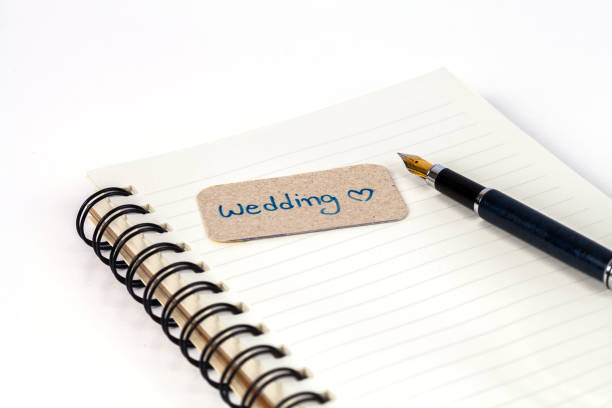 istock wording tag with fountain pen on book 694716756