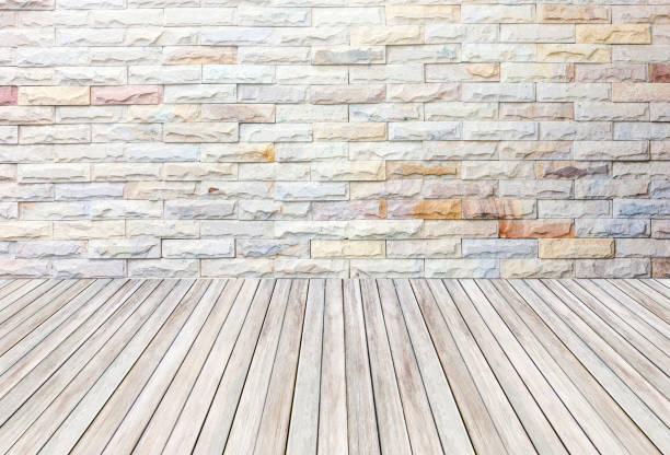istock empty room with stone wall and wooden floor. 694720022