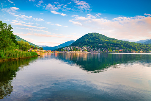 Lake Lugano, also called Ceresio, and Ponte Tresa at sunrise, on a beautiful summer day. Province of Varese, northern Italy