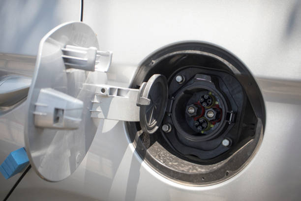 istock recharge plug of electric car 694728844
