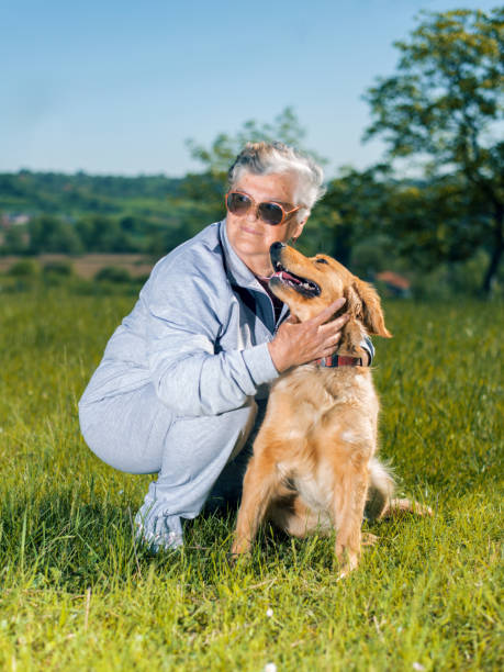 istock Senior woman and her dog 694729786