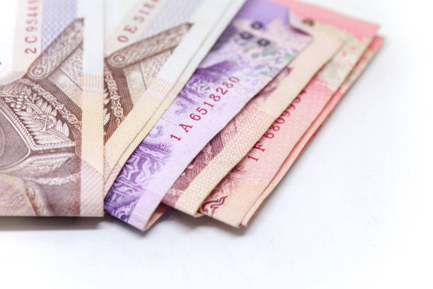 istock Thai currency in background and isolated, Thai bath cash 694738878