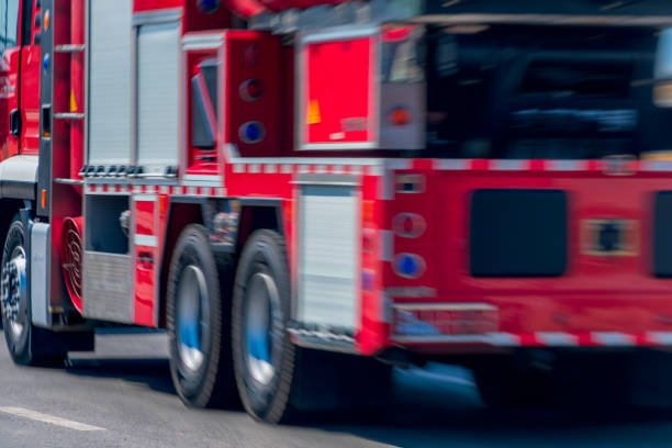 blurred motion of speeding fire truck,China.