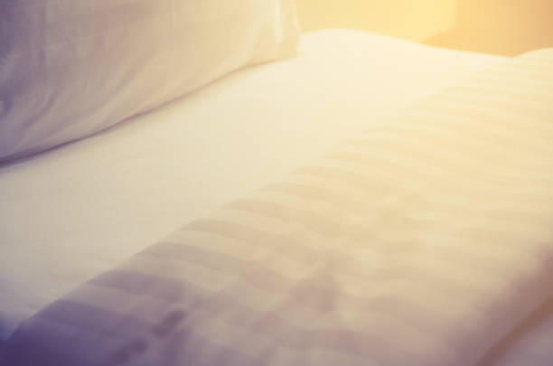 istock quilt bed  white pillows on white bed in bedroom 694747210