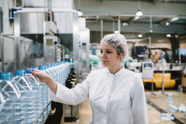 istock Young woman factory worker 694747450