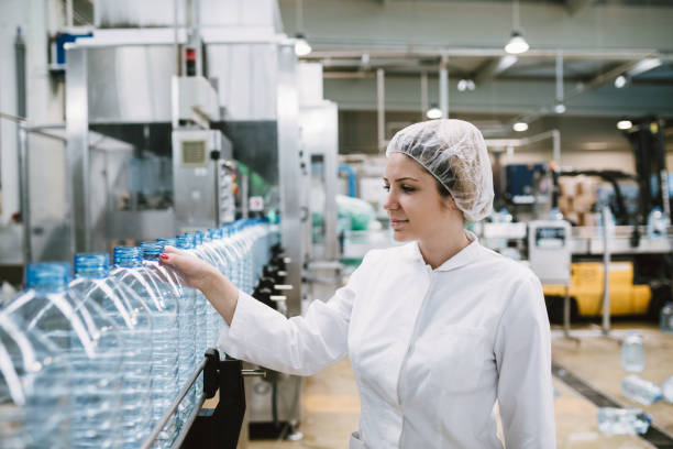 istock Young woman factory worker 694747500