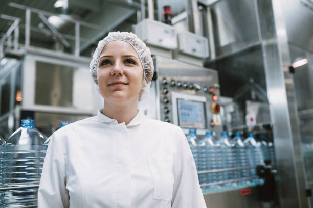 istock Young woman factory worker 694747510