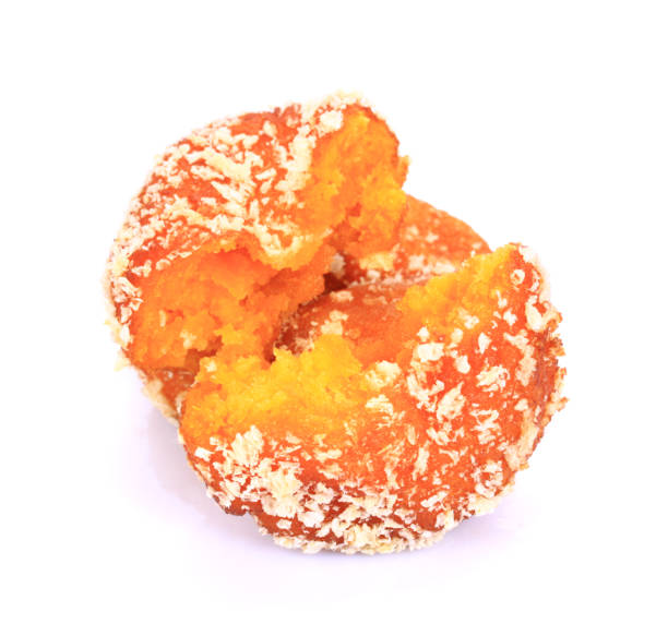 istock Glazed Autumn Pumpkin Donuts   on the white background 694751088