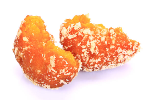 istock Glazed Autumn Pumpkin Donuts   on the white background 694751104