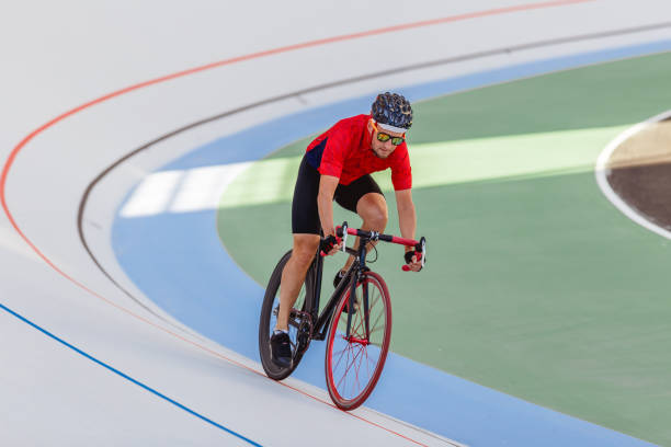 istock Active man on white velodrome outdoor 694764218