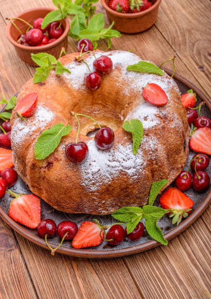 istock Strawberry cake on the wooden background. 694764478
