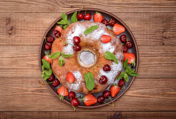 istock Strawberry cake on the wooden background. 694764484
