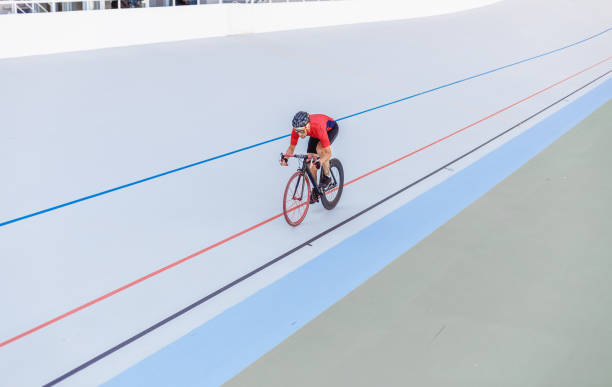 istock Racing cyclist on velodrome outdoor 694764490