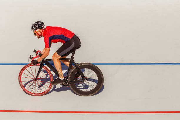 istock Racing cyclist on velodrome outdoor 694764568