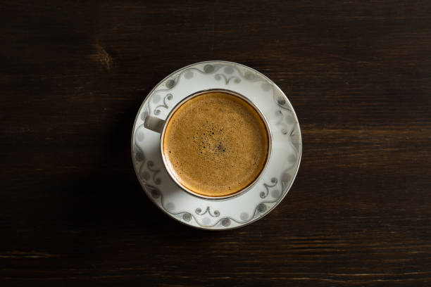 istock Coffee on Wooden Background 694771590
