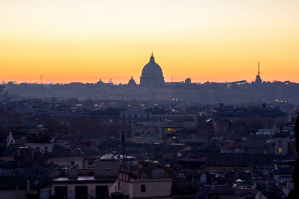 istock Panorama view of Rome at sunset with St Peter Cathedral 694777564