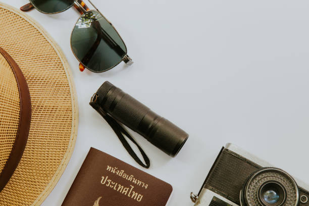 istock Traveler's accessories and costume on white background with copy space 694780656