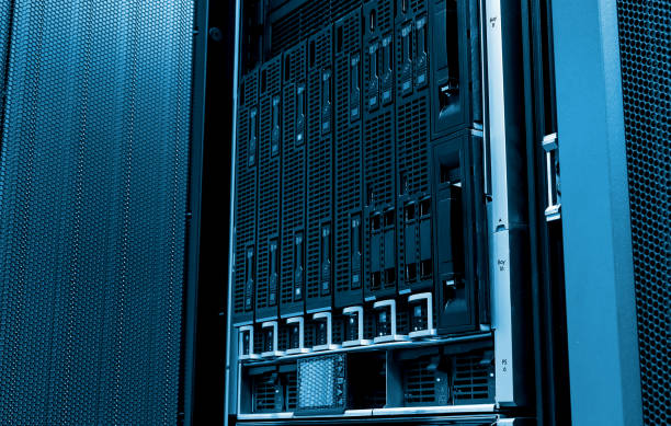 istock Blade server close-up in series of mainframes in modern data center. Blue tone 694799314