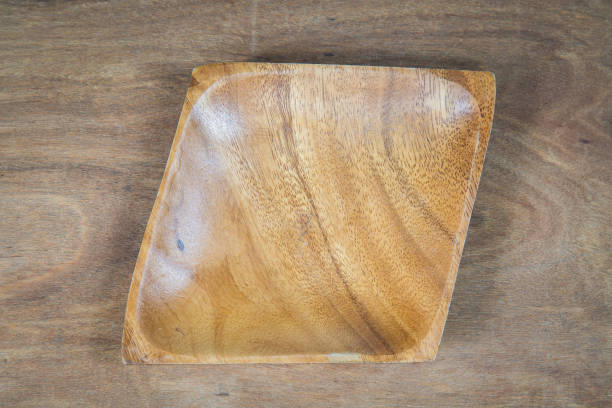 istock Empty plate on a wooden table , food display montage 694805492
