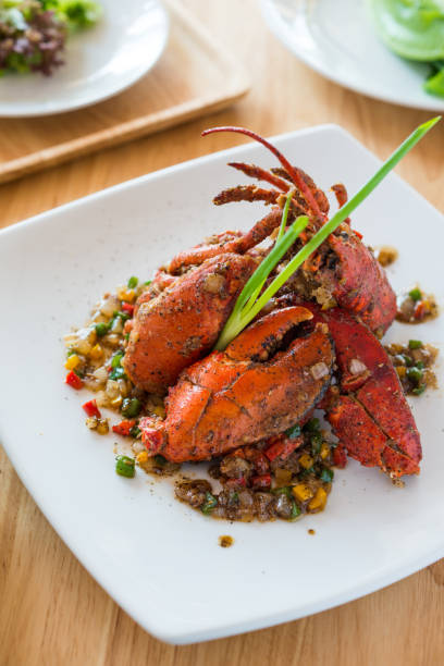 istock stir fried garlic pepper lobster 694806168
