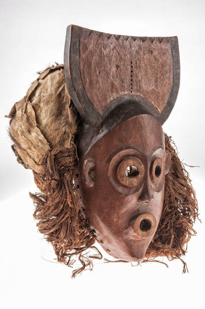 istock African wooden mask isolated on white background 694811702