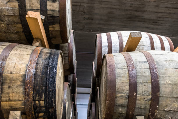 istock Whisky barrels in the store house 694812528
