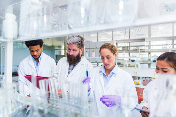 istock Youn scientists in a chemical laboratory 694815608