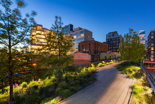 The Highline (High Line Park aerial greenway) at twilight in summer. Chelsea, Manhattan, New York City.