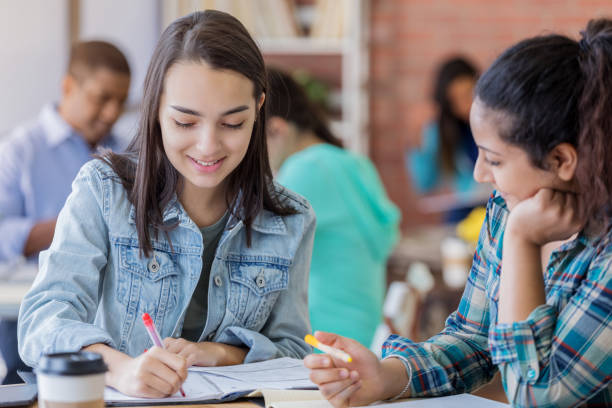 istock College girls brainstorm together 694822354