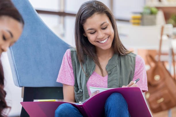 istock Mixed race college student studies in dorm room 694822370